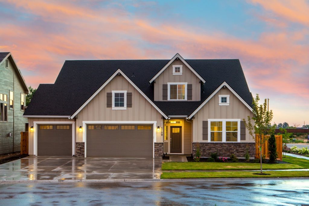 brown-and-gray-painted-house-in-front-of-road-1396122 Charming family home in Boise, ID with a modern facade and spacious garage.